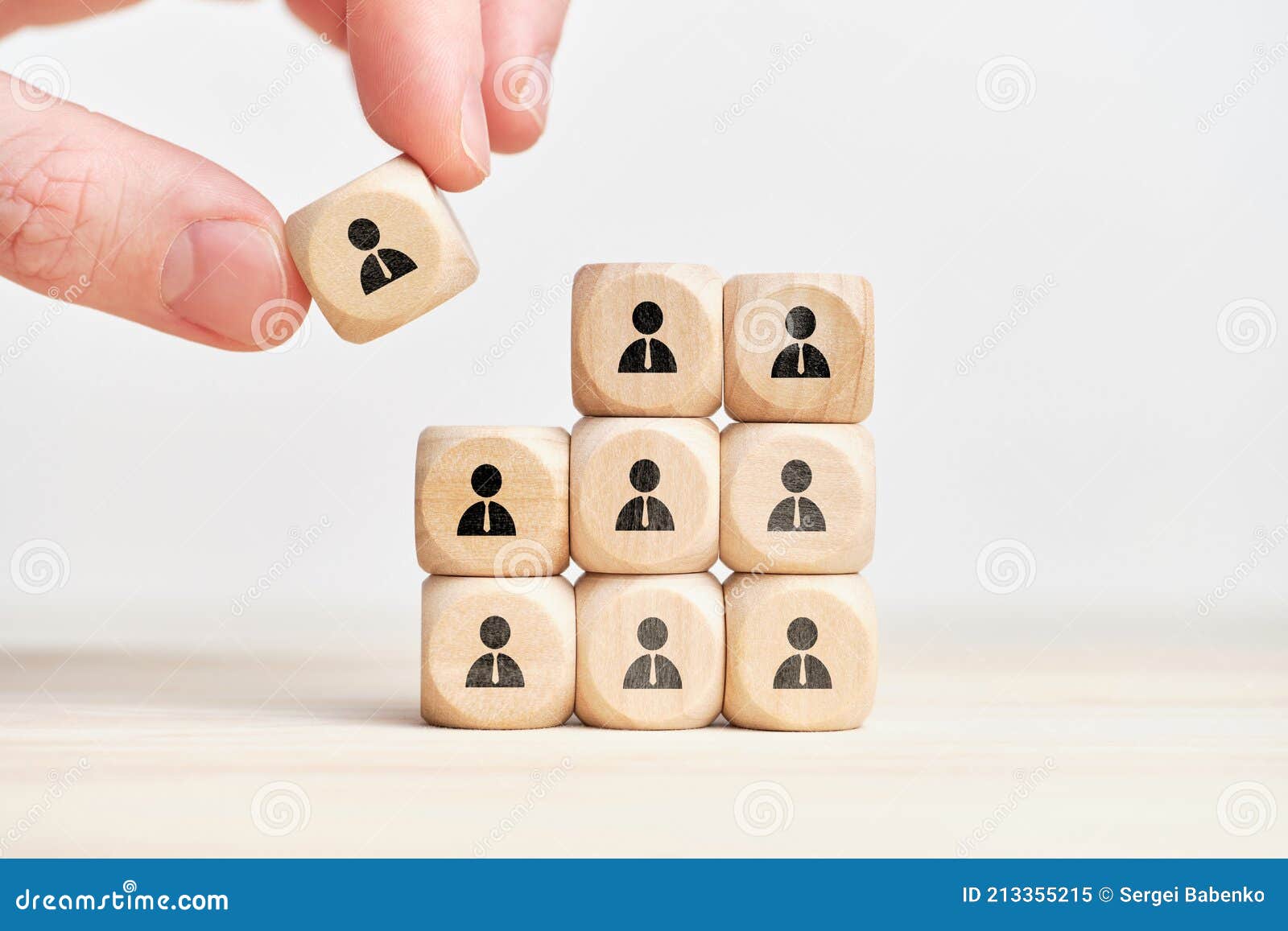 teambuilding and teamwork concept on wooden cubes with abstract personas employee