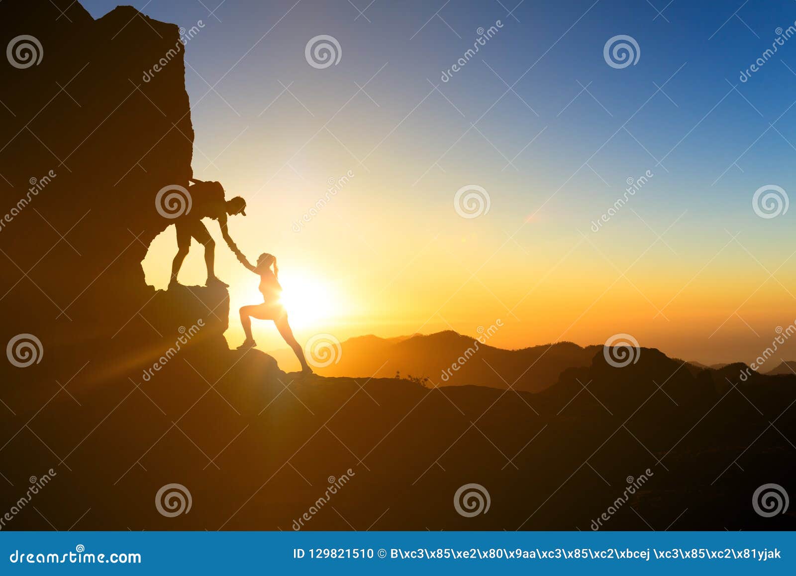 teamwork couple climbing helping hand