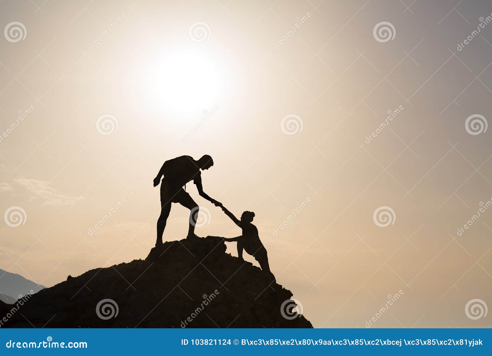 teamwork couple helping hand trust in inspiring mountains