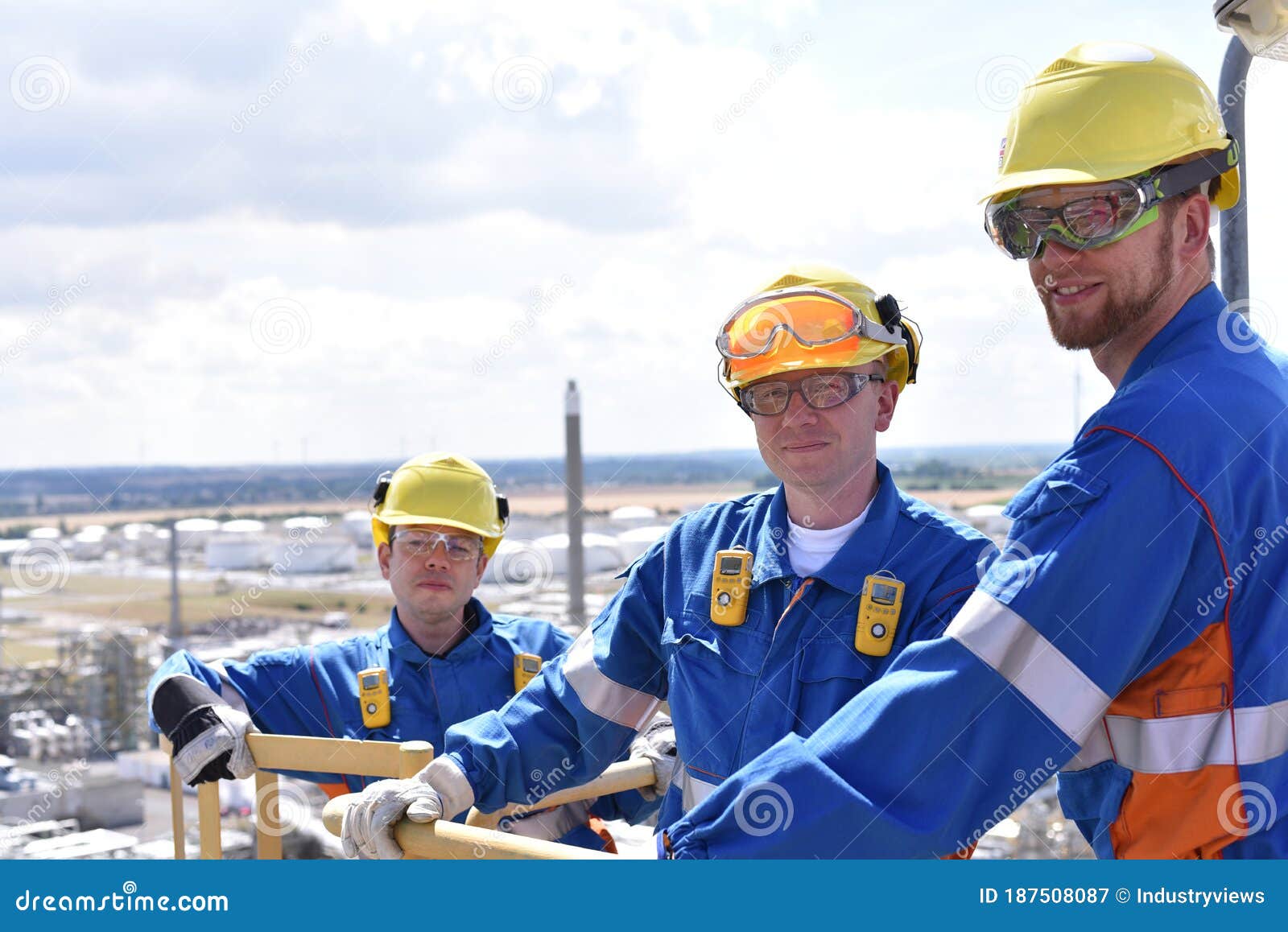 Teamwork Group of Industrial Workers in a Refinery Oil Processing