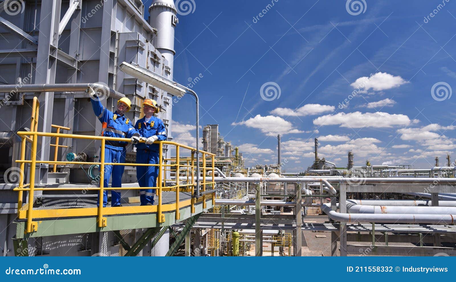 Teamwork Group of Industrial Workers in a Refinery Oil Processing