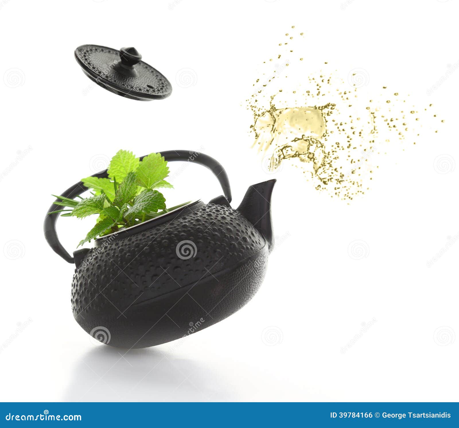 Teapot with fresh herbs stock photo. Image of splash 39784166