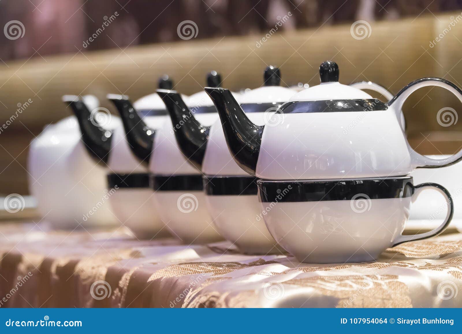 Teapot Pouring Tea into a Cup on a Wood Surface Stock Photo Image of