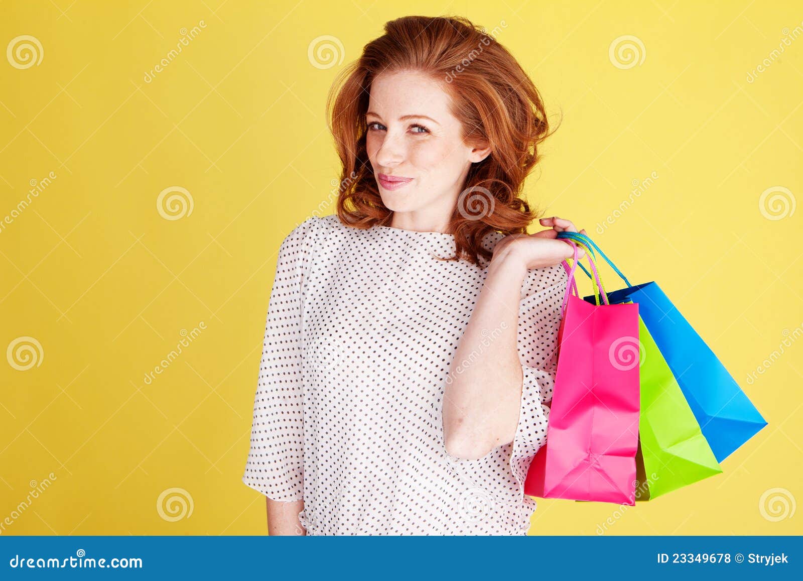 teasing woman with colourful bags