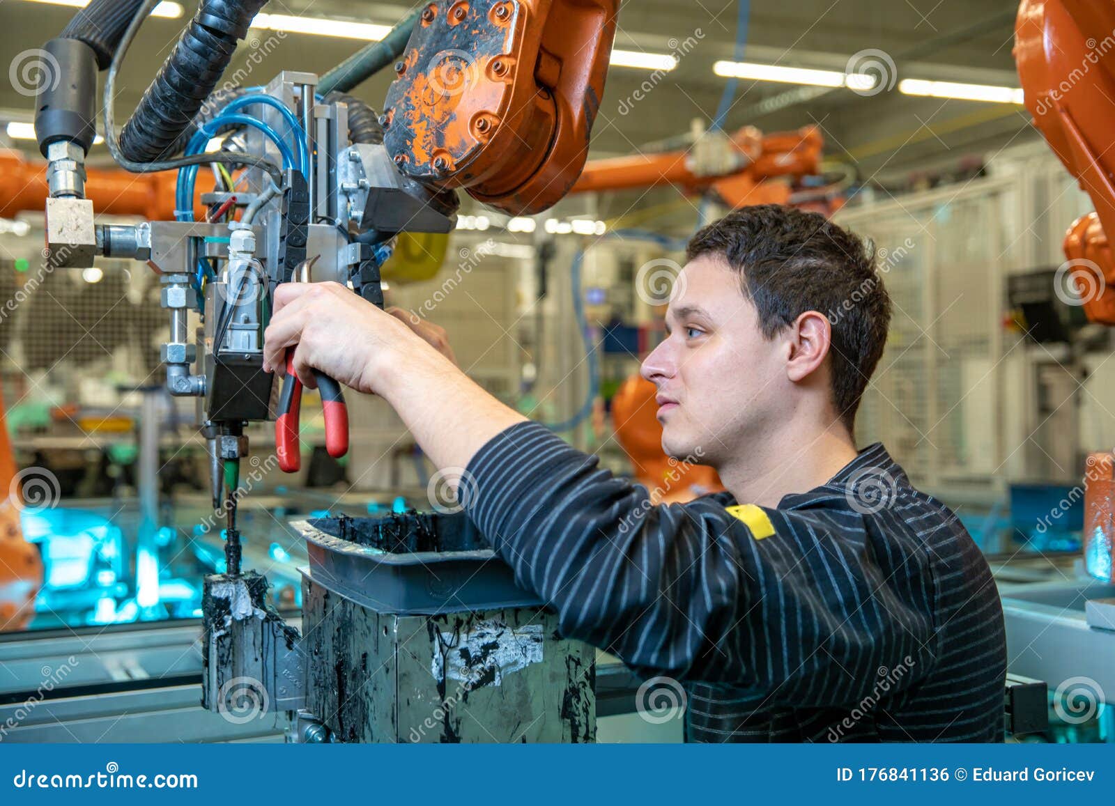 Jobs done by robots in a car factory