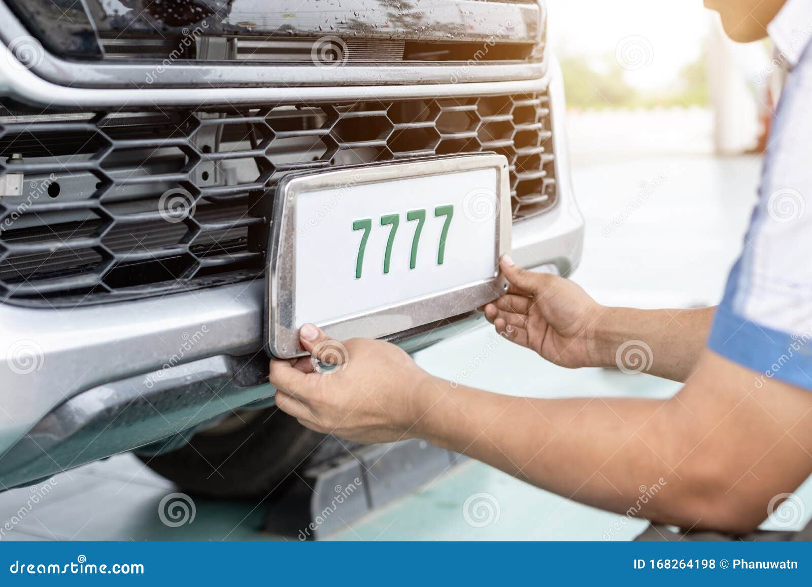 Technician Changing Car Plate Number in Service Center Stock Photo