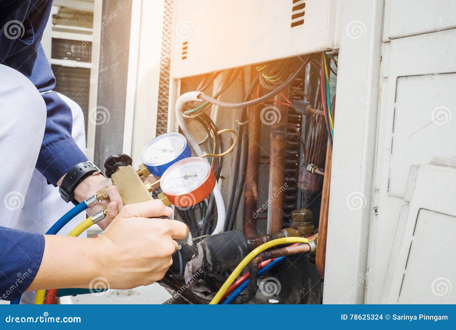 technician checking air conditioner