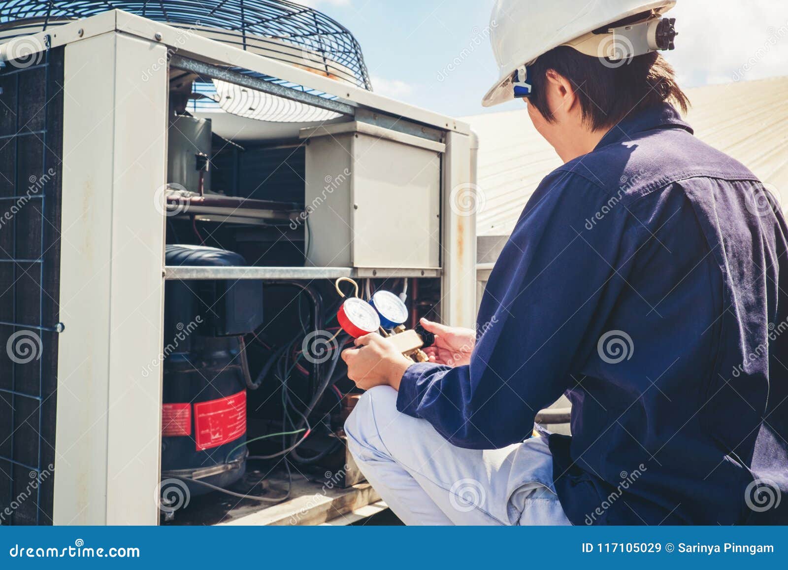 technician is checking air conditioner