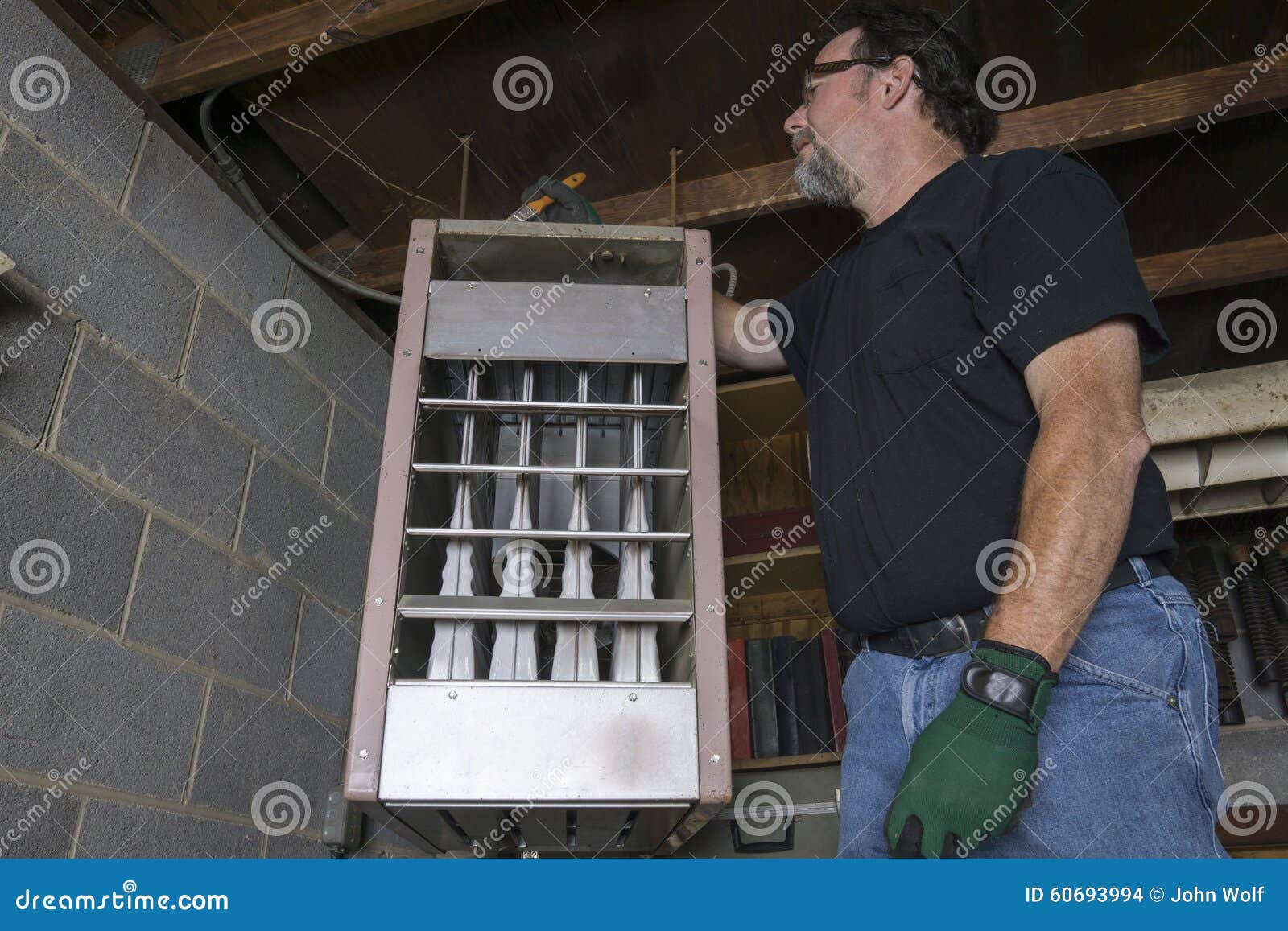 Technician Cleaning Top Of Overhead Gas Heater Stock Photo Image