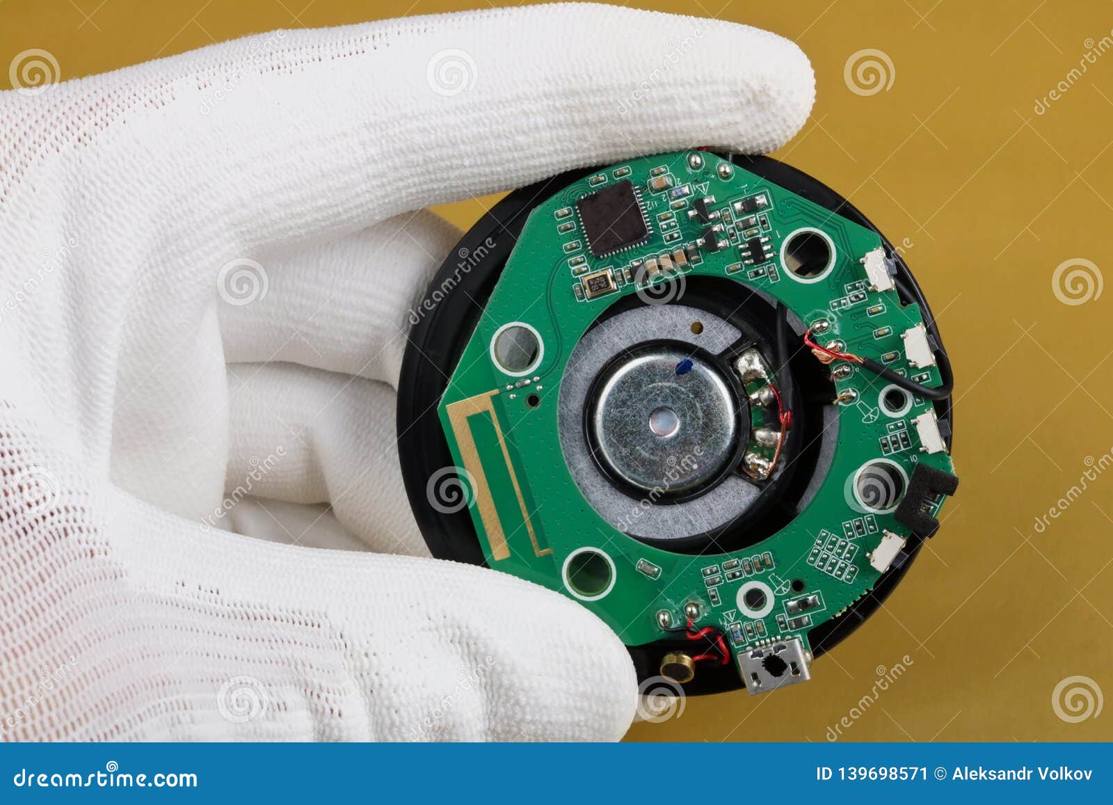 a technician controls the quality of a bluetooth module for mobile audio device