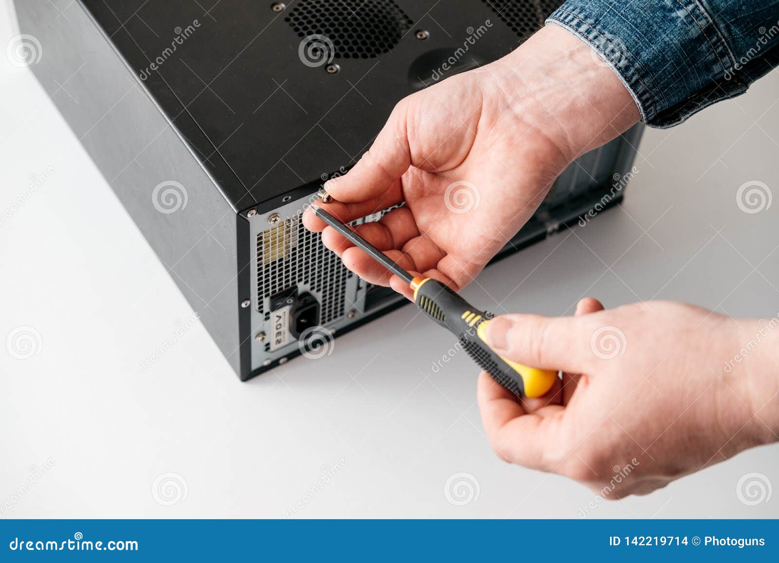 technician disassemble computer with a screwdriver for problems diagnostic