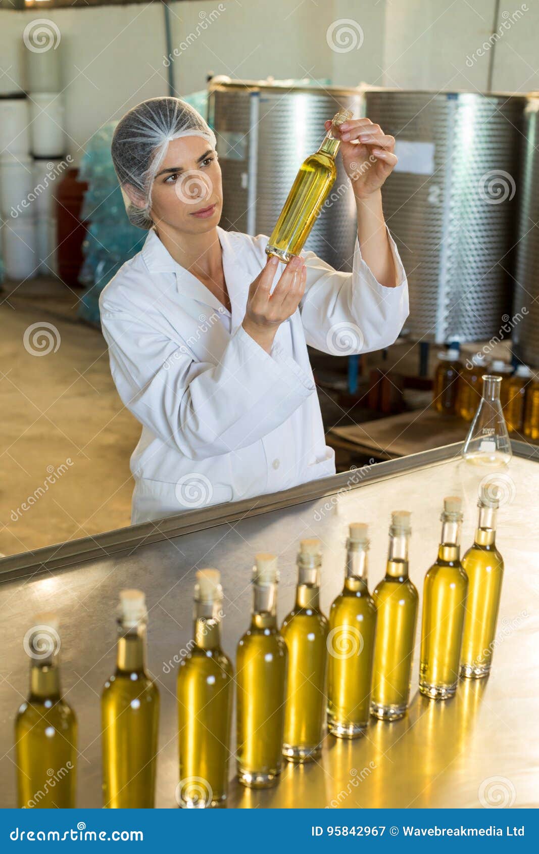 https://thumbs.dreamstime.com/z/technician-examining-olive-oil-factory-95842967.jpg