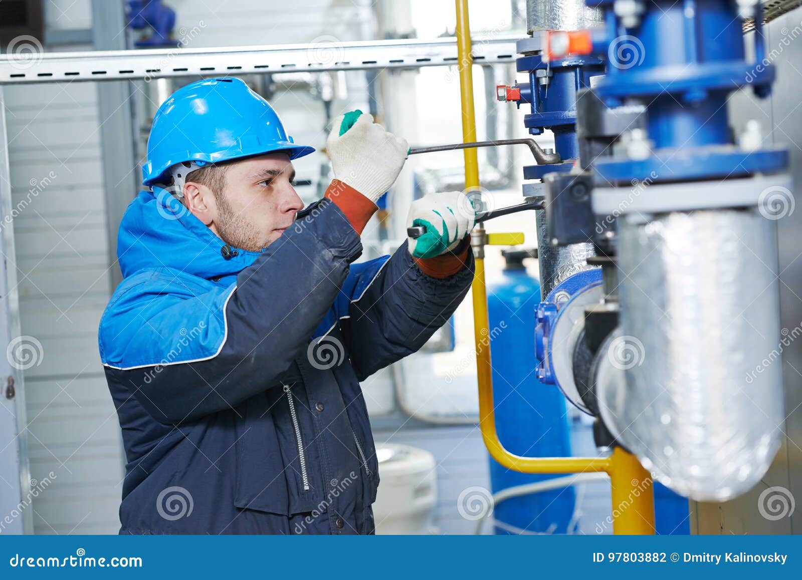 technician of heating system in boiler room