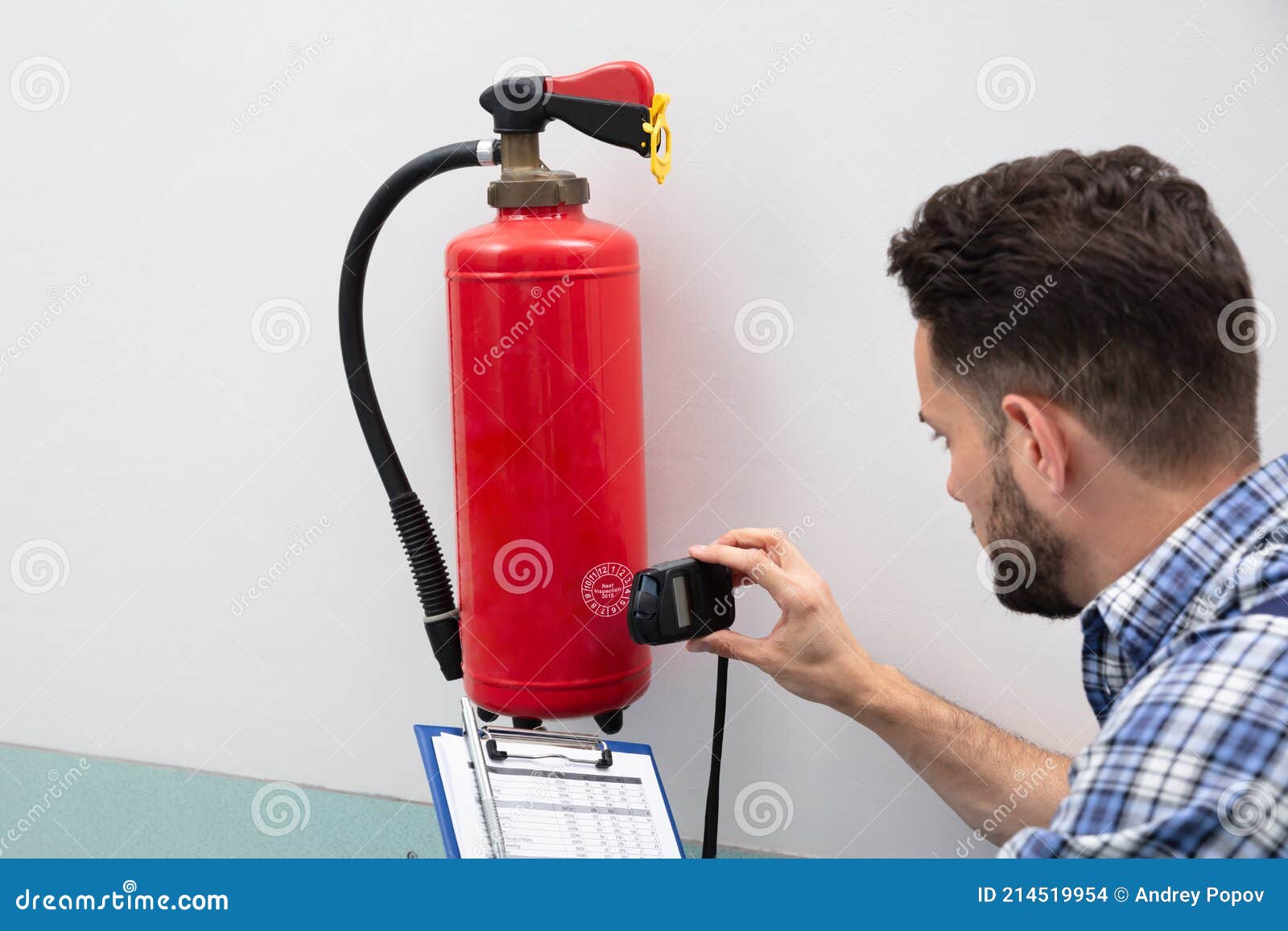 Technician Inspecting Fire Extinguisher Stock Photo Image of