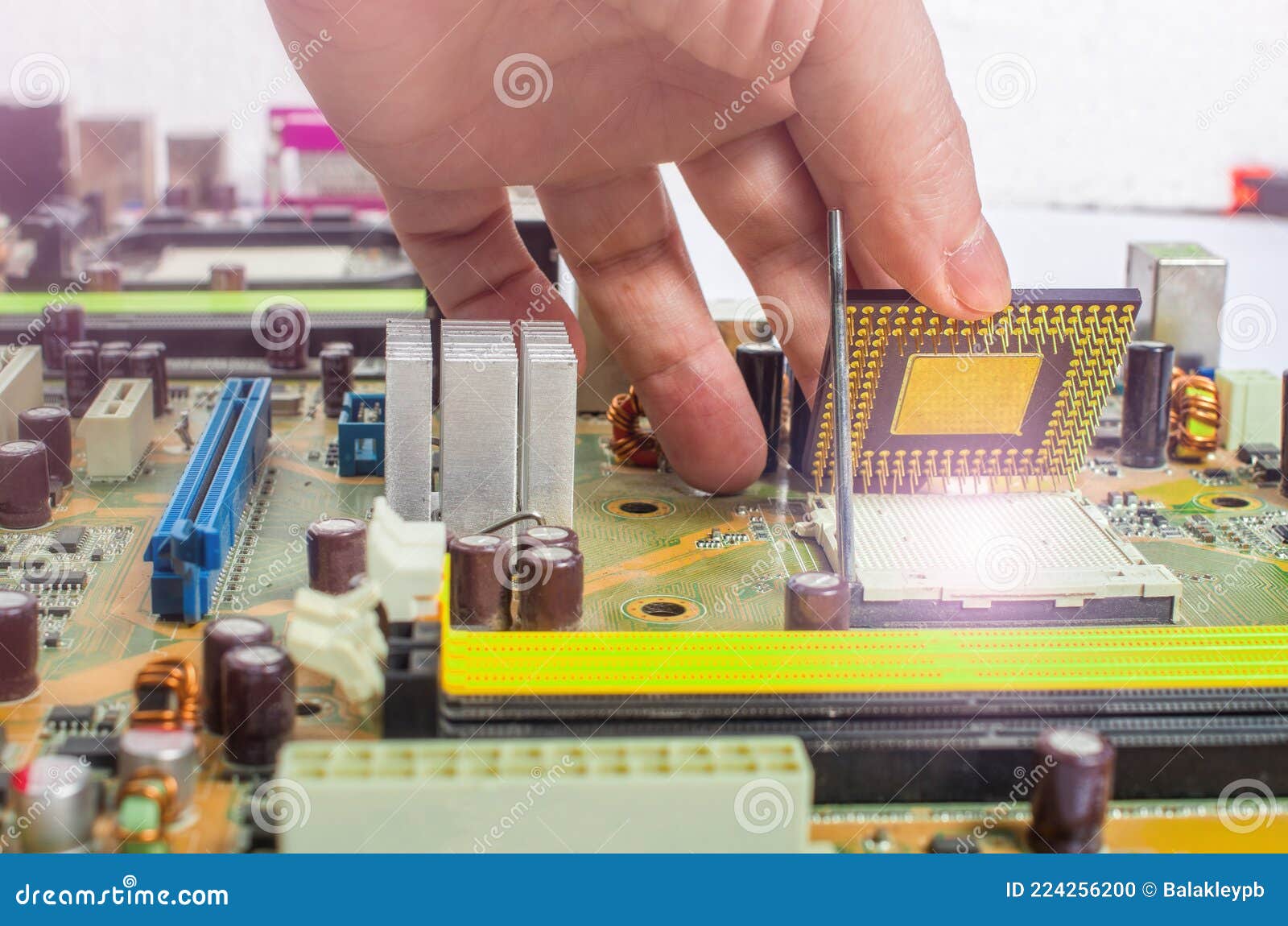 Installing A Processor Fan On The Computer Motherboard. Computer Repair