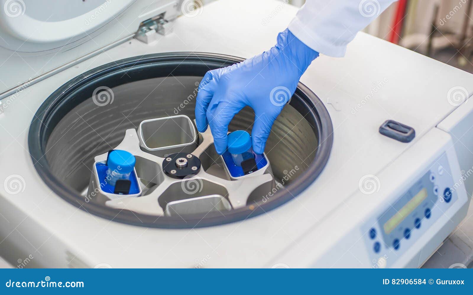Technician Loading a Sample To Centrifuge Machine Stock Photo Image