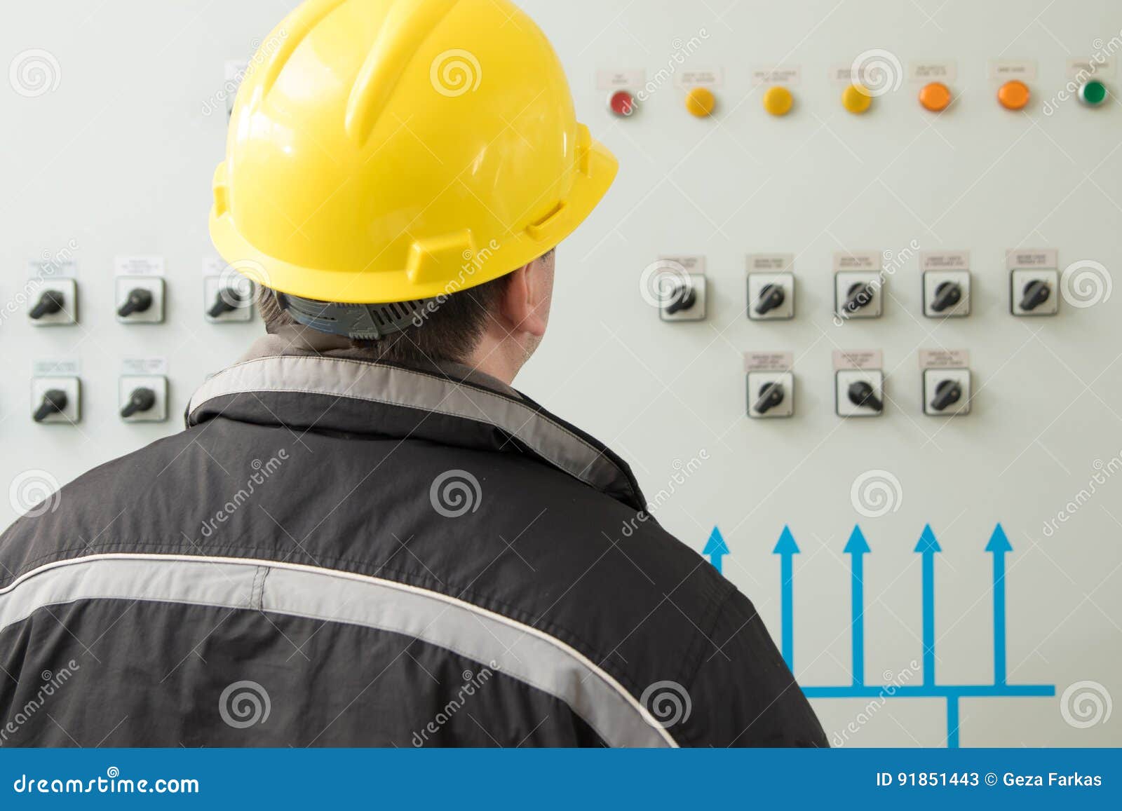 Technician Reading Instruments in Power Plant Control Center Stock