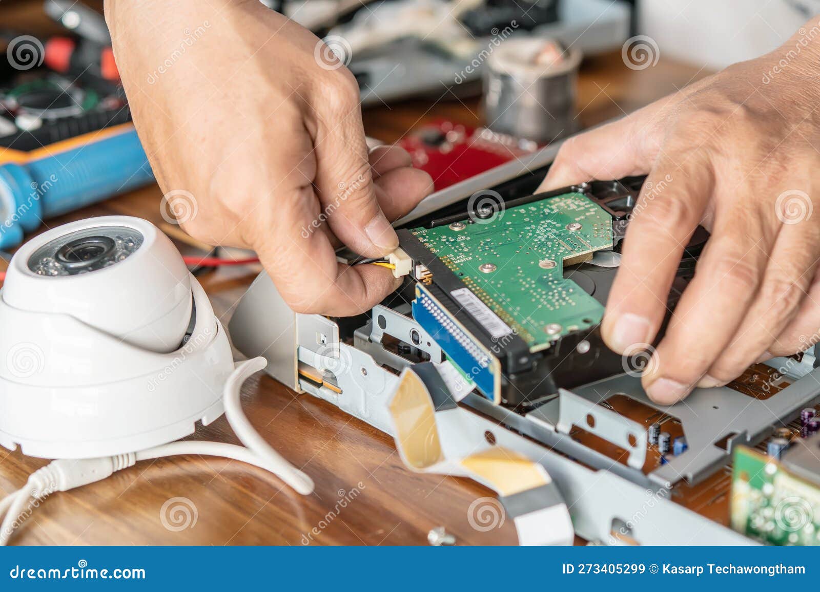 Technician Remove a Hard Disk Drive from the CCTV DVR Recorder Case, To