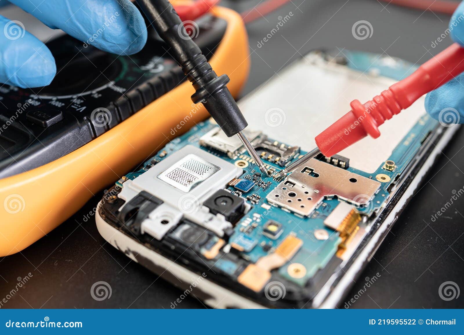 Technician Repairing Inside of Mobile Phone by Soldering Iron