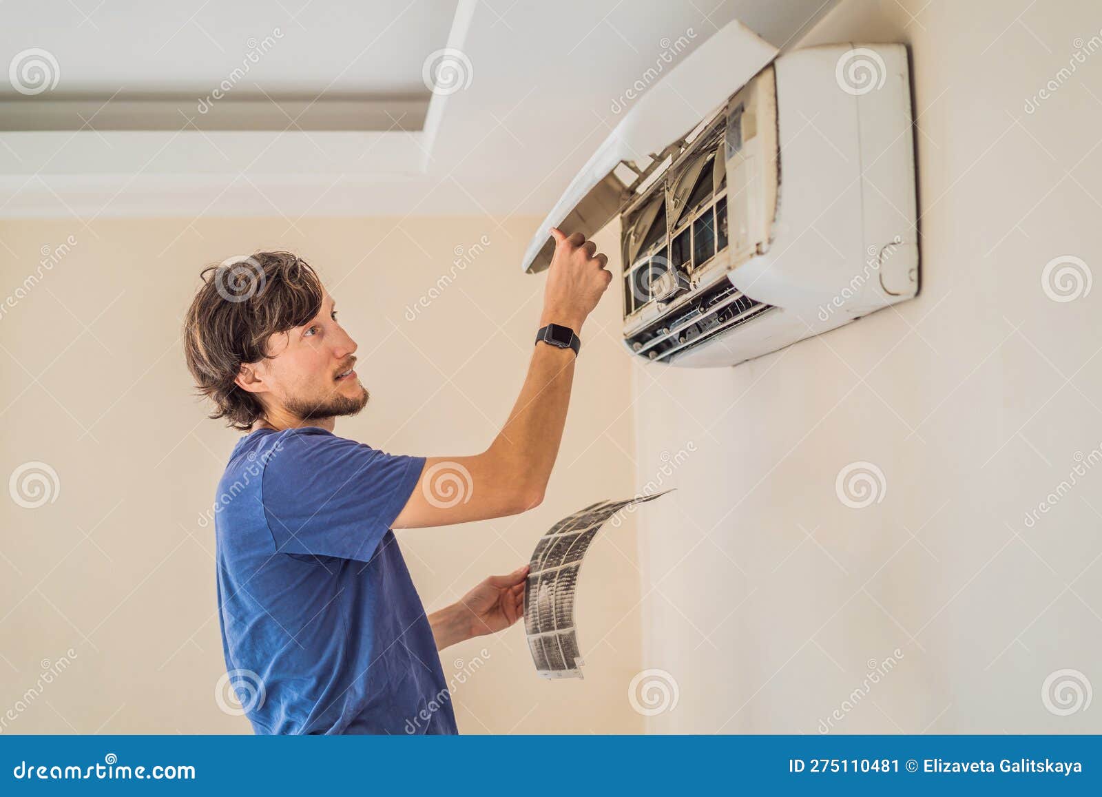 Technician Service Removing Air Filter of the Air Conditioner for