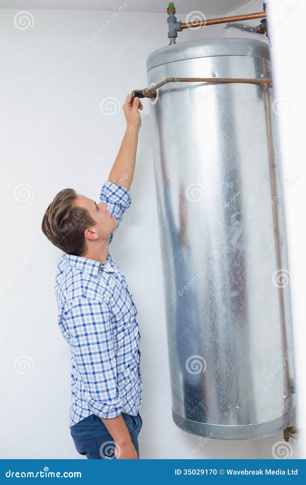 Technician Servicing an Hot Water Heater Stock Photo Image of