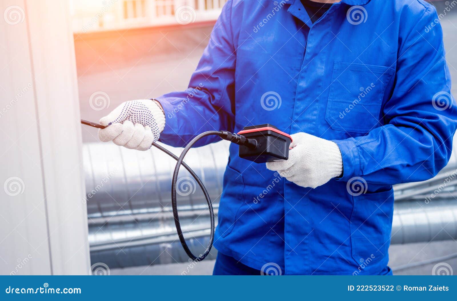 The Technician Uses a Digital Camera To Check the Clogging of the Heat