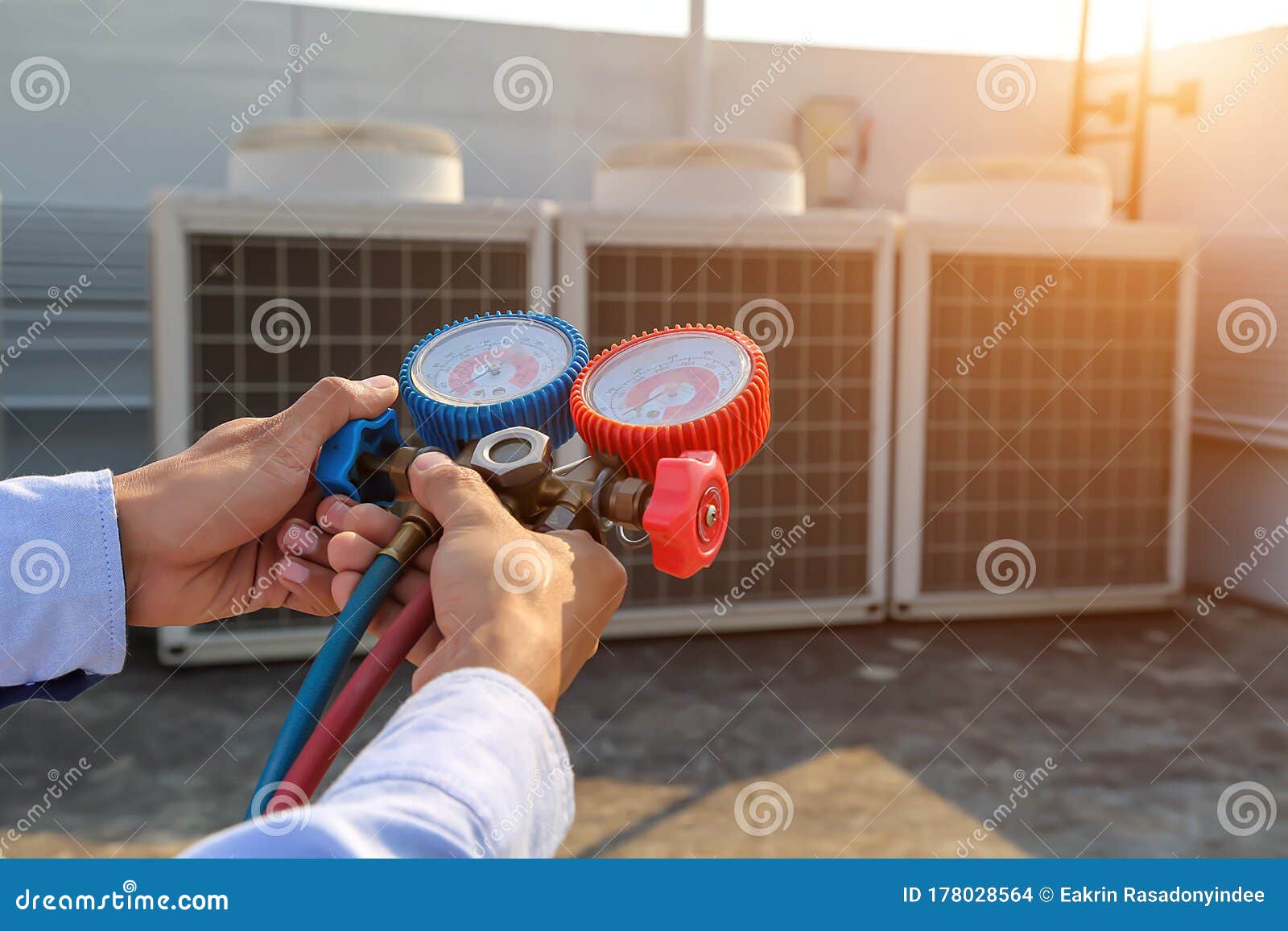 Technician Using Measuring Equipment for Filling Air Conditioners Stock