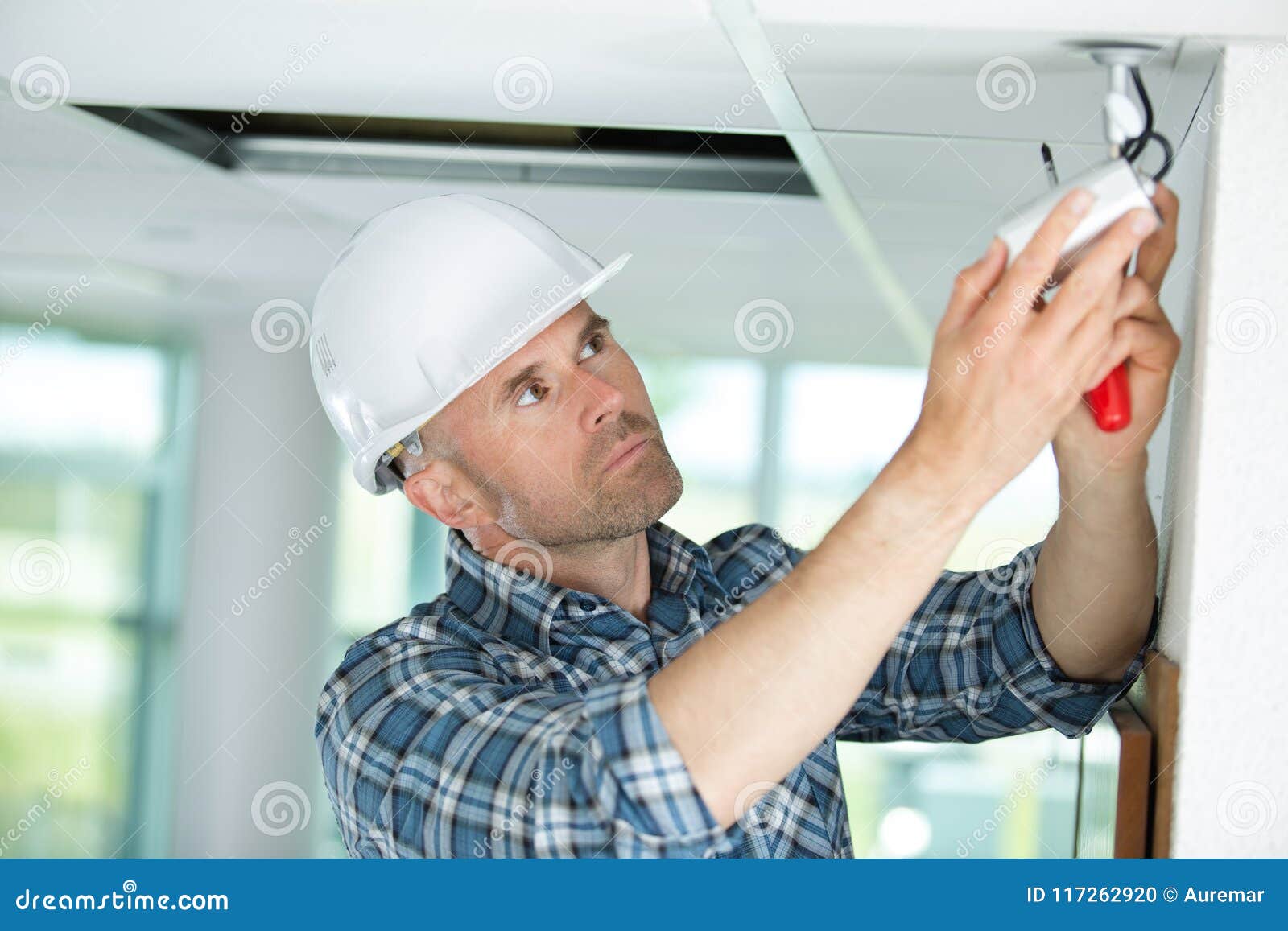 Technician Worker Adjusting Video Surveillance System Stock Photo