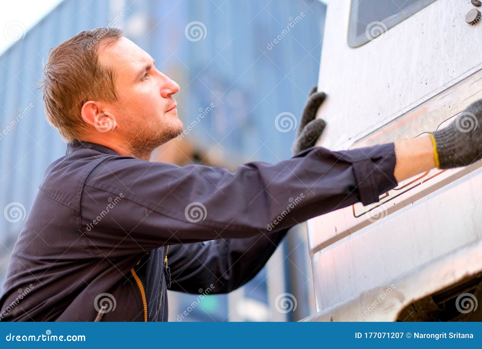 Technician or Worker in Cargo Shipping Check or Maintenance Truck in