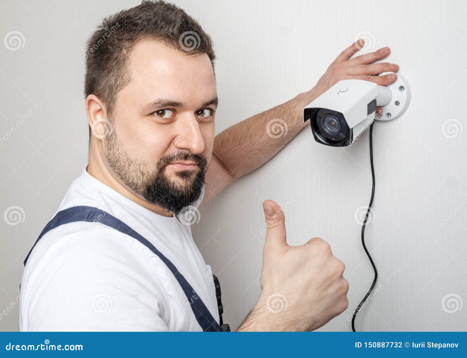 Technician Worker Installing Video Surveillance Camera Stock Photo