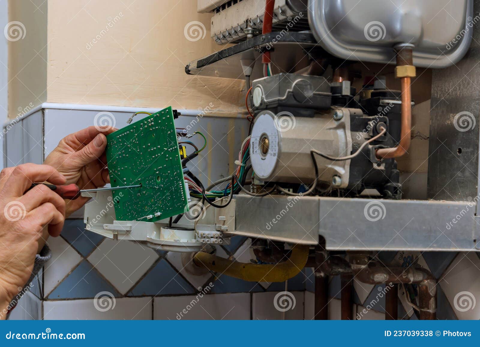 Technician Worker Looking Inside Gas Heater Trying To Fix the Problem