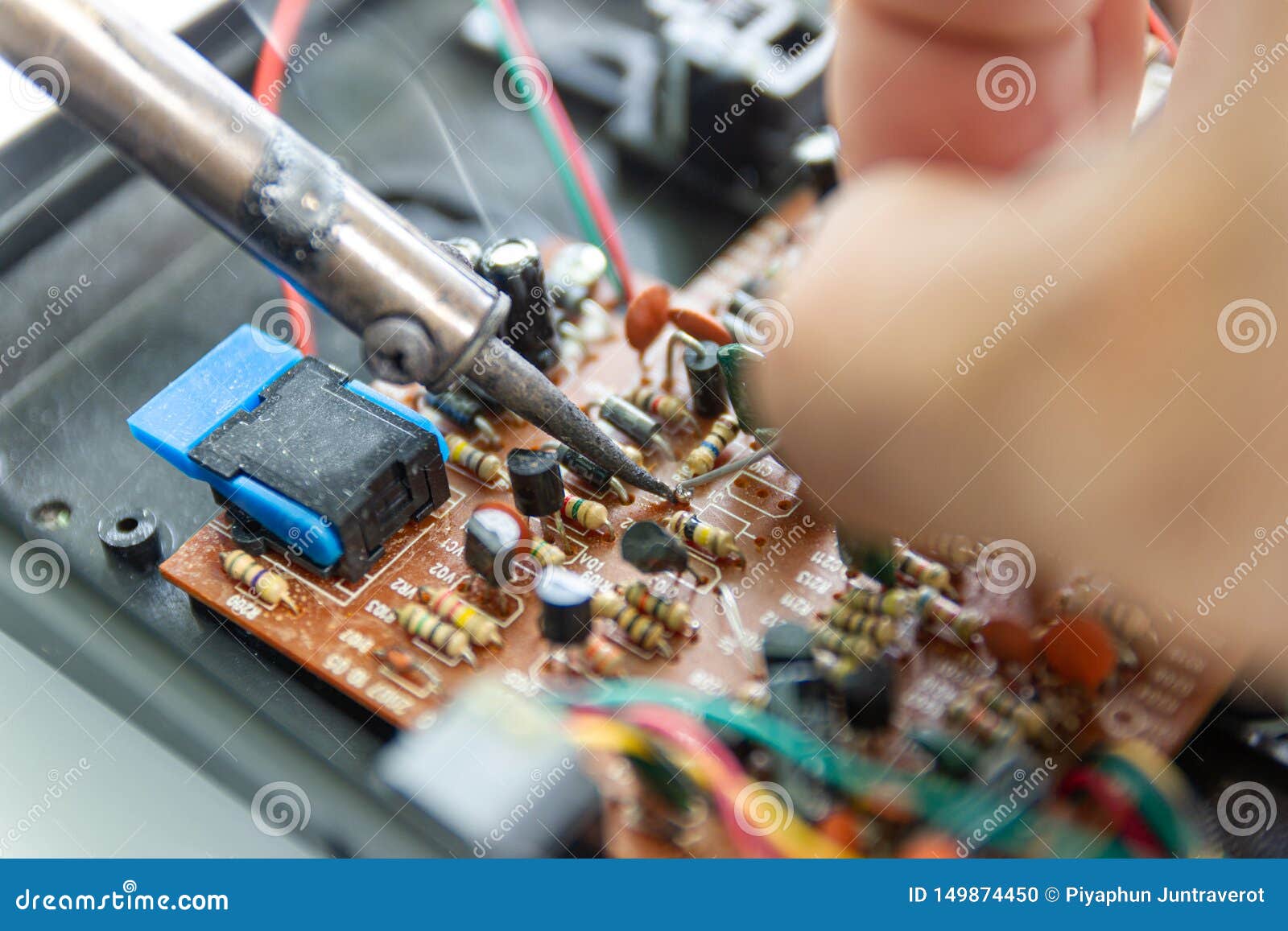Technicians are Using a Soldering Iron for Repairing Electronic Stock Photo Image of