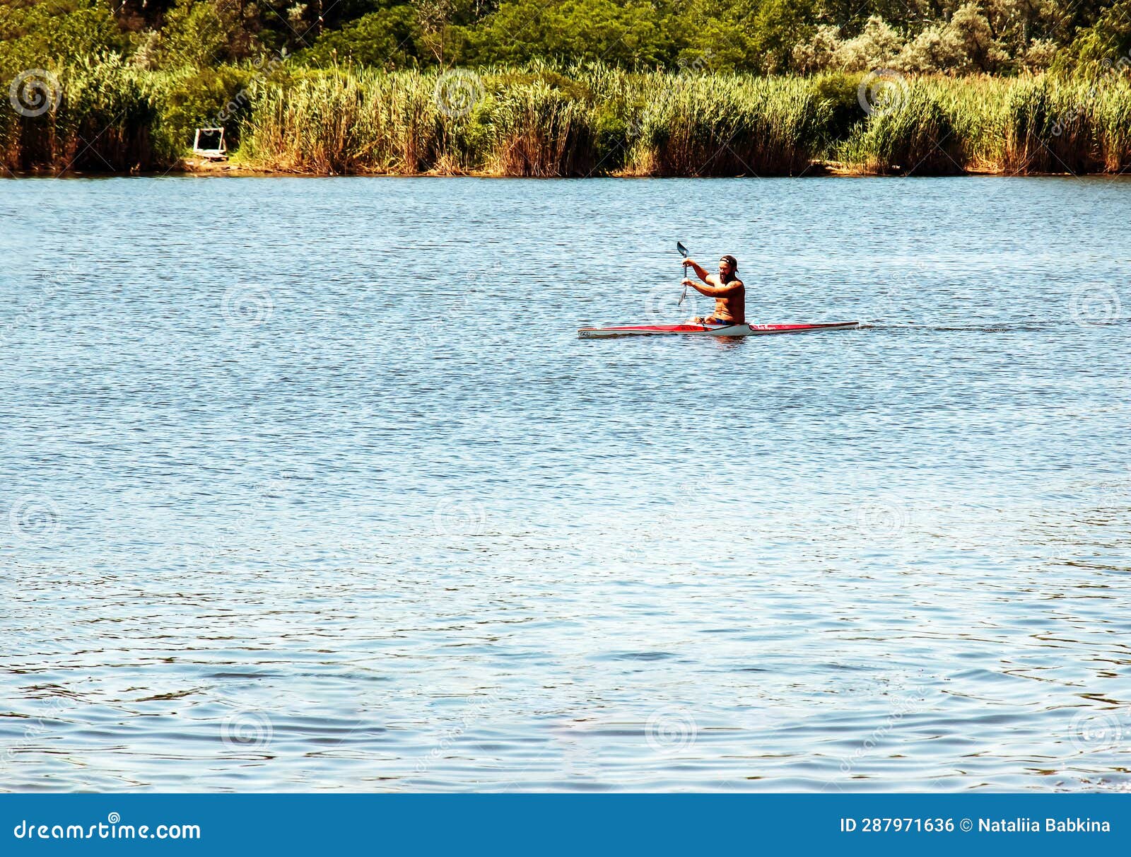 Technique of Rowing of a Single Athlete on a Kayak. Paddle Splash