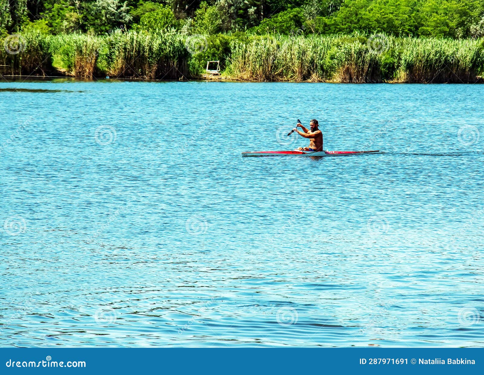 Technique of Rowing of a Single Athlete on a Kayak. Paddle Splash