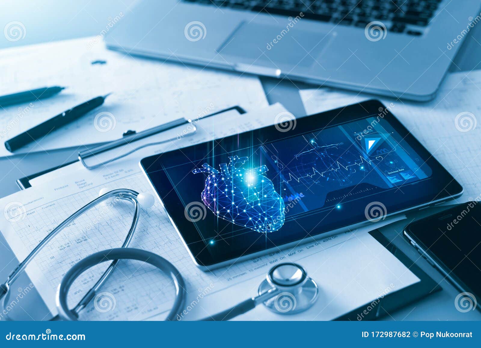 technology and healthcare, doctor`s cardiologist tablet and heart disease health care analysis data on screen and stethoscope.