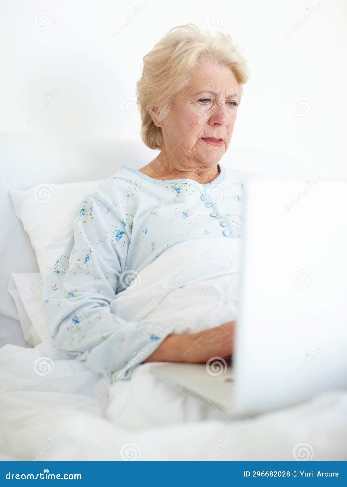 Technology Keeps Her Connected With Her Loved Ones Elderly Female Patient Browses A Laptop From