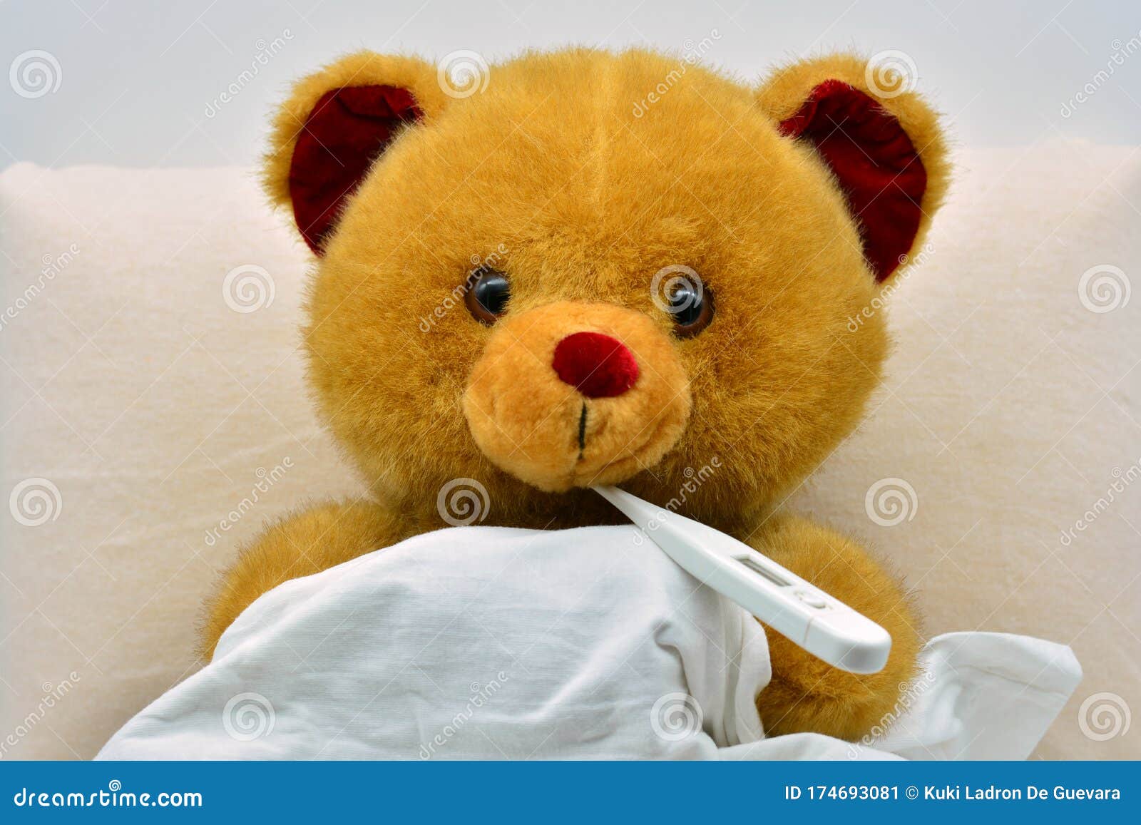 teddy bear in bed, sick with fever