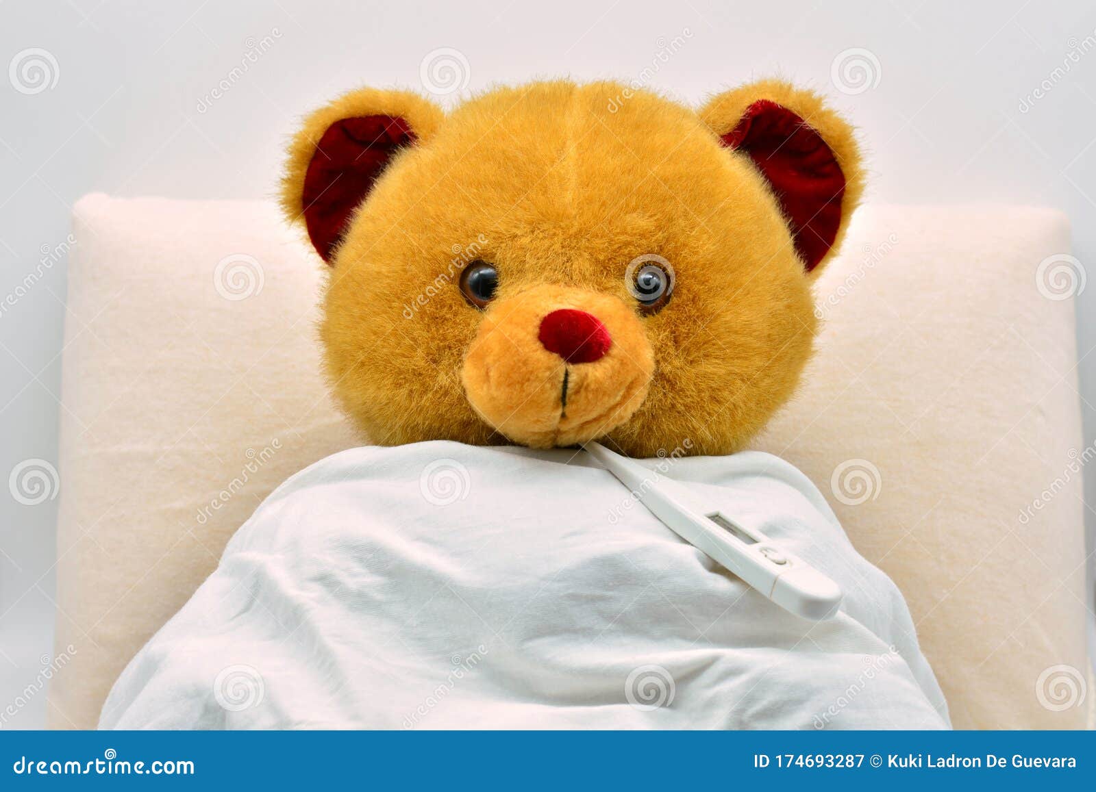 teddy bear in bed, sick with fever