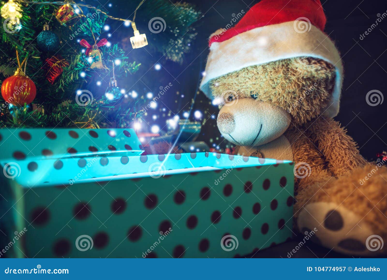 Download A Teddy Bear Opens A Gift Background Glowing Christmas Tree Concept New