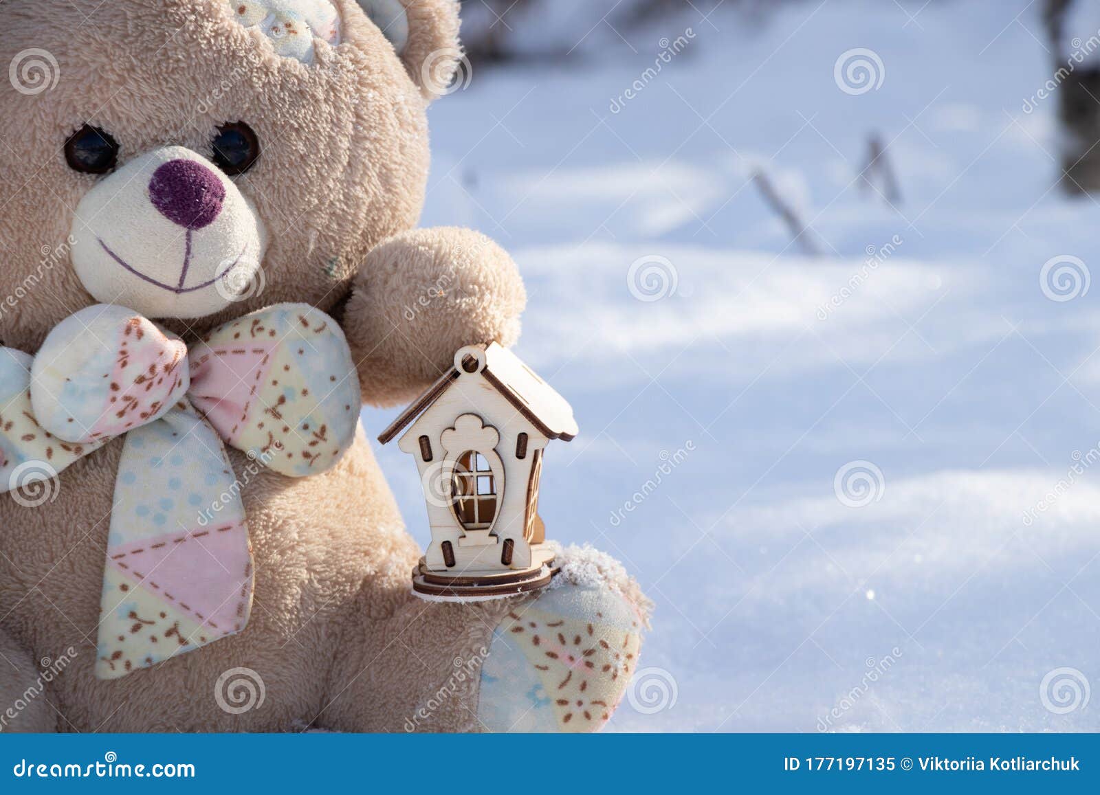 Teddy Bear and a Small Wooden House in the Snow on the Street in ...