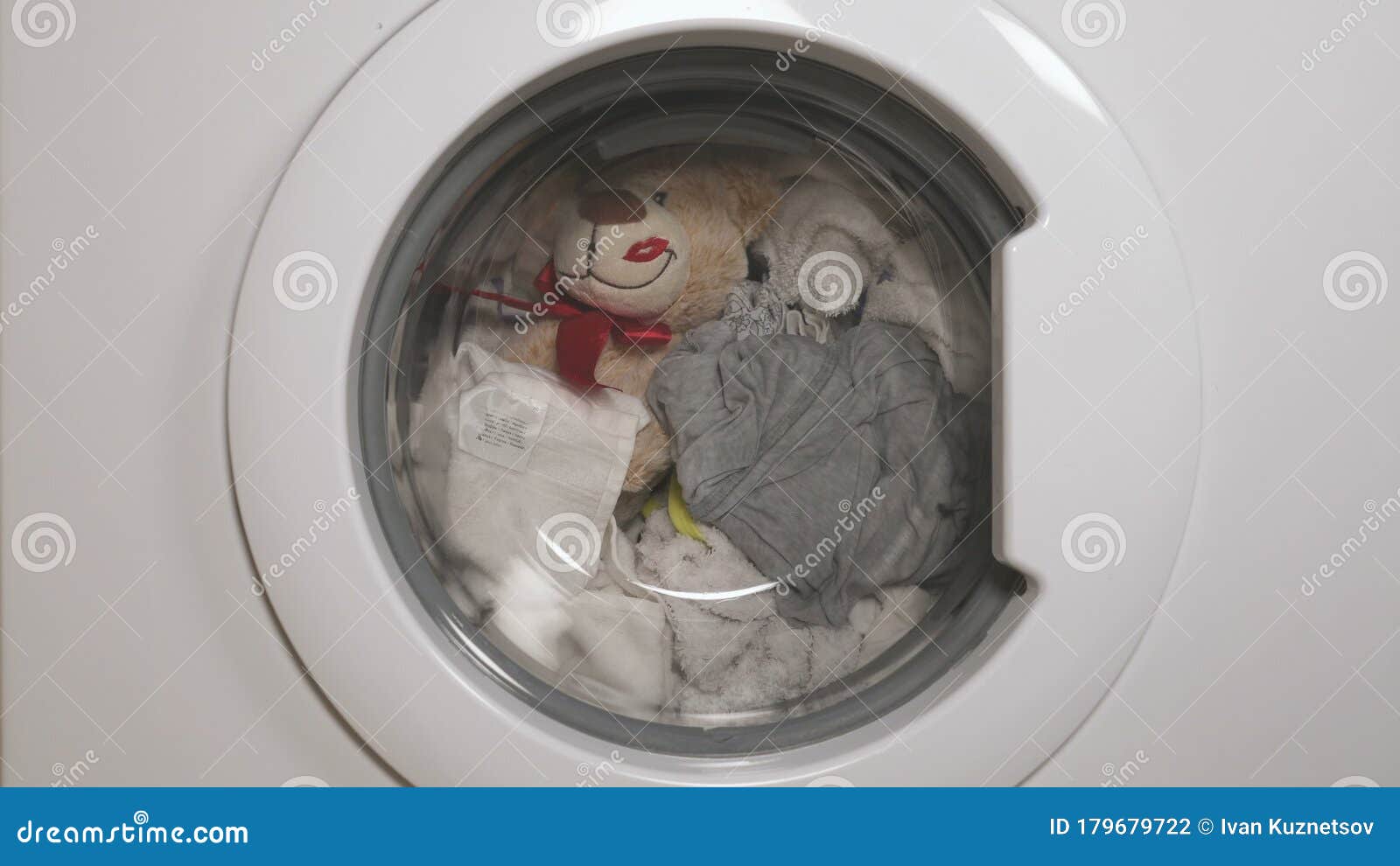 Teddy Bear Washes in the Washing Machine. Stock Footage Video of