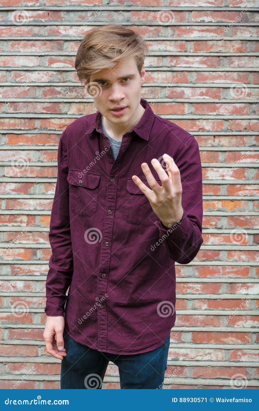 teen boy gesticulating trying to explain himself