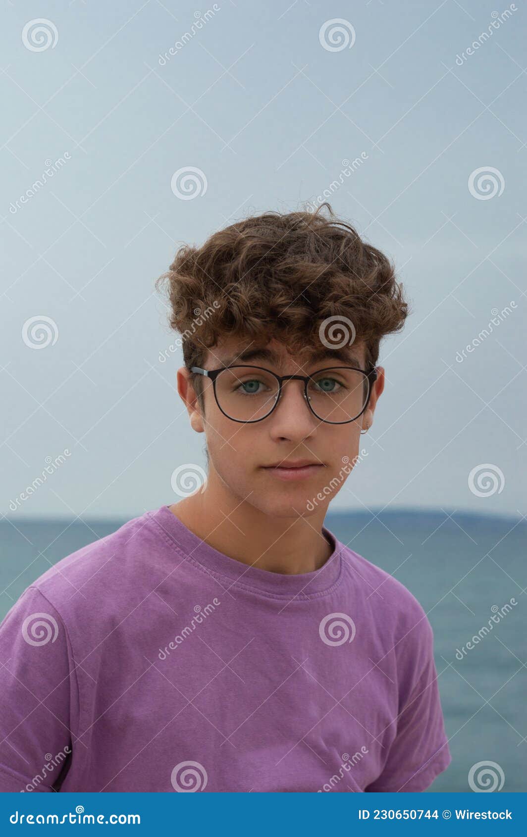 Teen Boy with Glasses and Curly Hair Looks at Camera with Serious Face Stock Photo - Image of caucasian, fashion: 230650744 Teen Boy with Glasses and Curly Hair Looks at Camera with Serious Face Stock Photo - Image of caucasian, fashion: 230650744