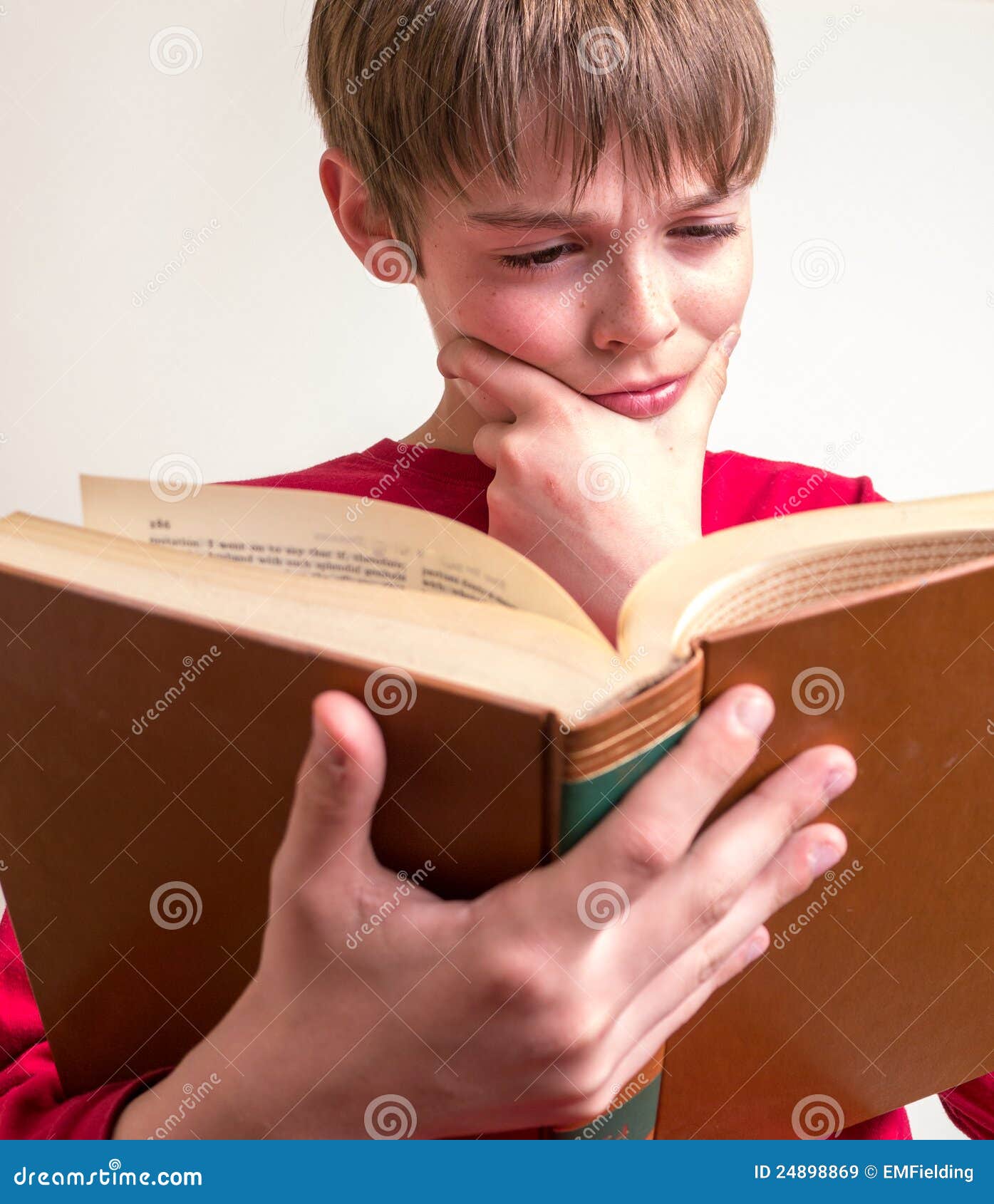 [Image: teen-boy-reading-book-24898869.jpg]