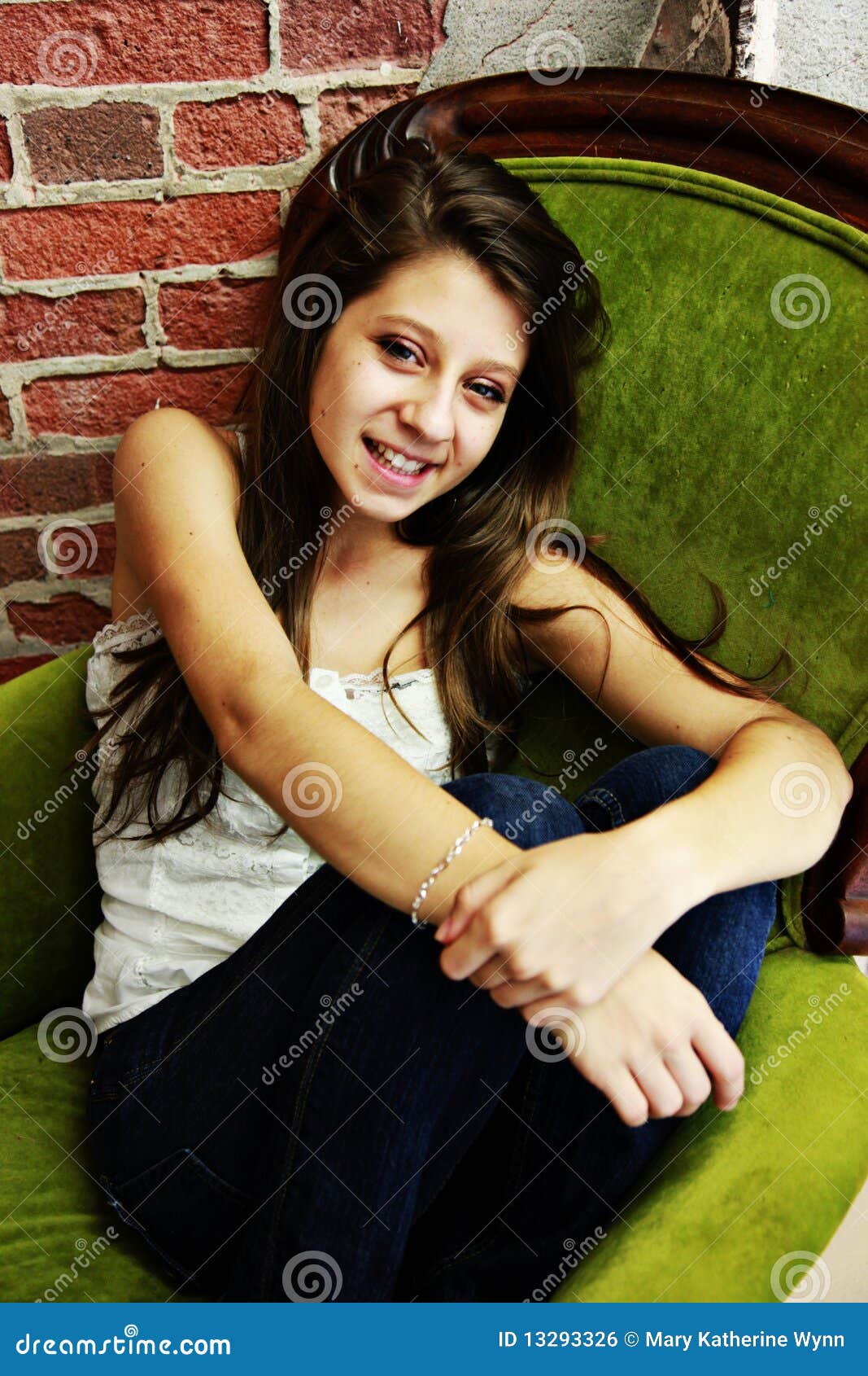 teen casually sitting in chair