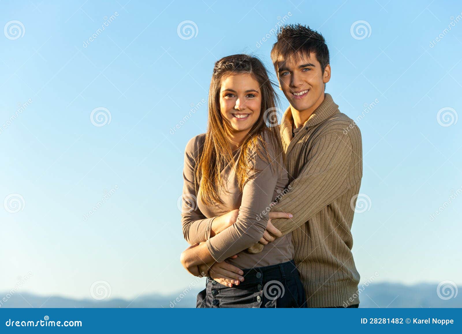 Teen Couple Embracing Outdoors Stock Photo Imag