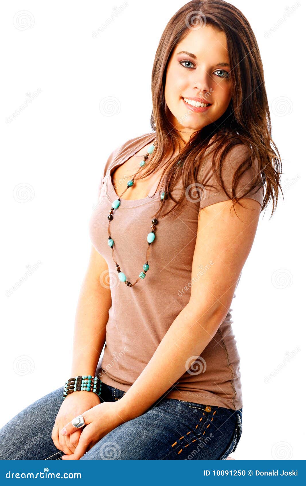 Teen fashion with cute seventeen year old brunette with a natural and beautiful smile.