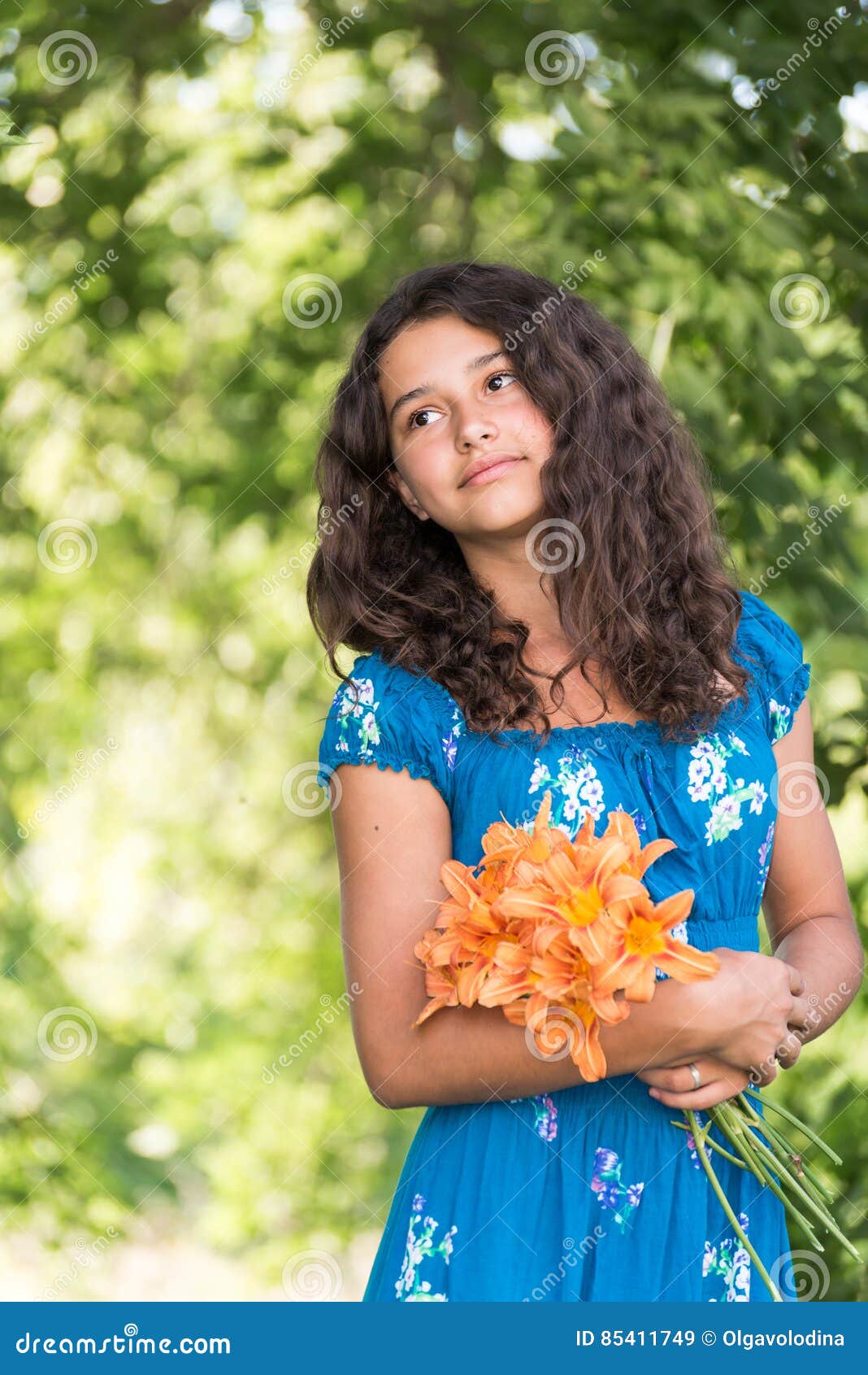 Teen Girl With Curly Dark Hair On Nature Stock Imag