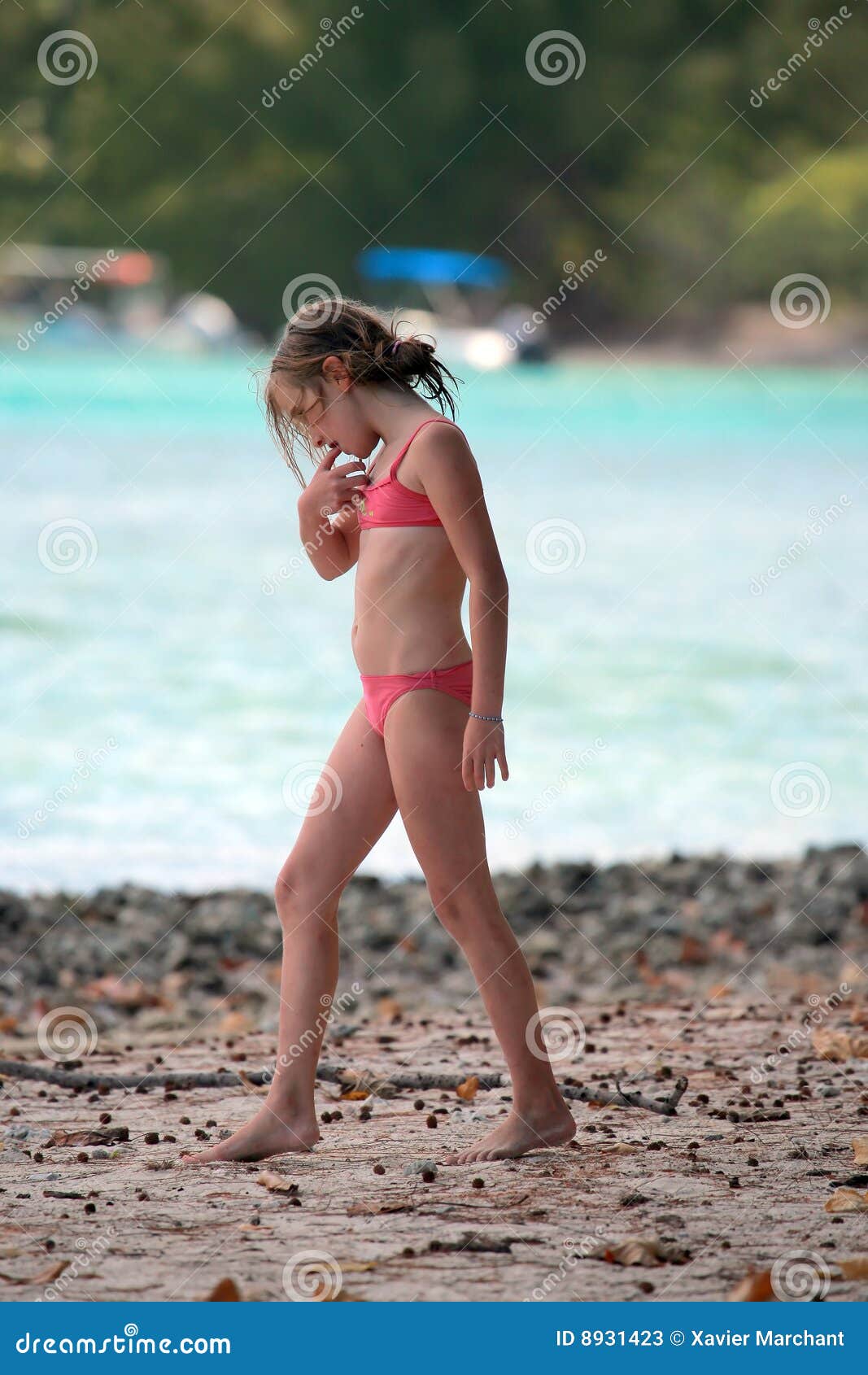 Teen girl eating nails stock image. Image of summer, swimsuit