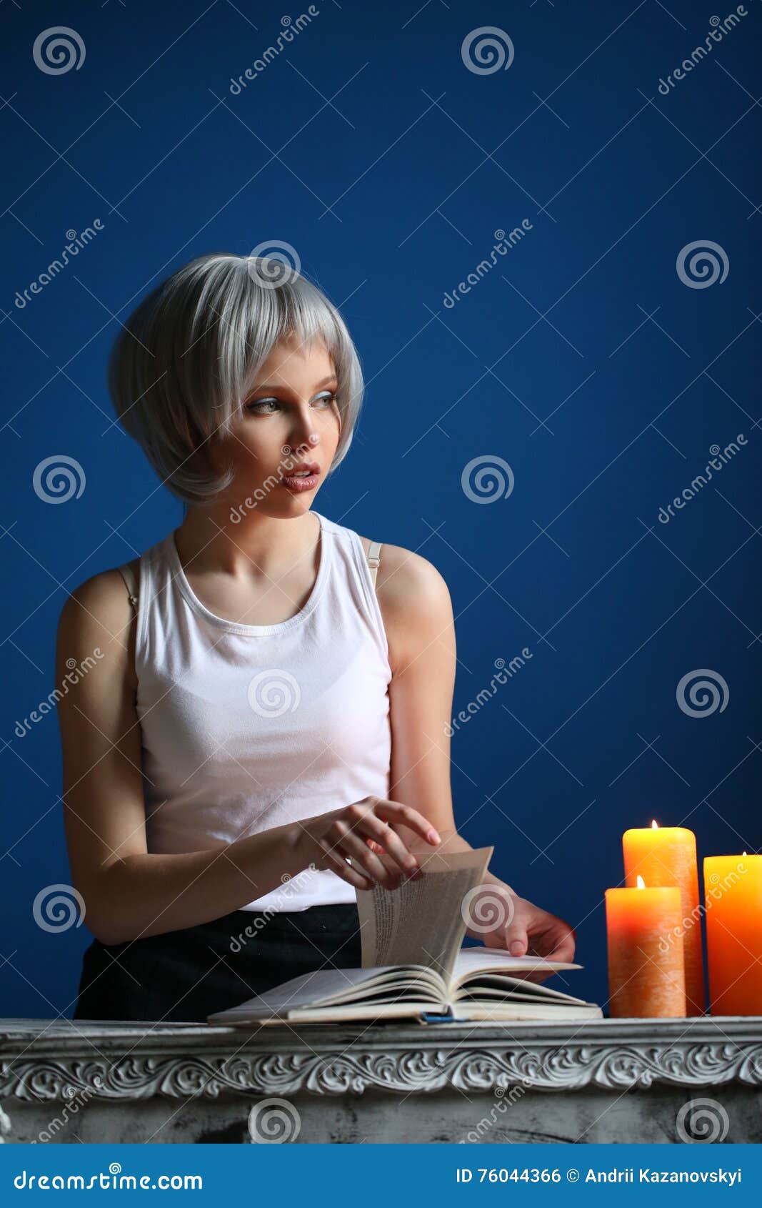 Teen Girl Posing And Leafing Through The Book Close Up